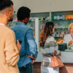 People are standing in line at the pharmacy.